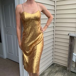 DKNY gold sequin dress. With a slit size 2